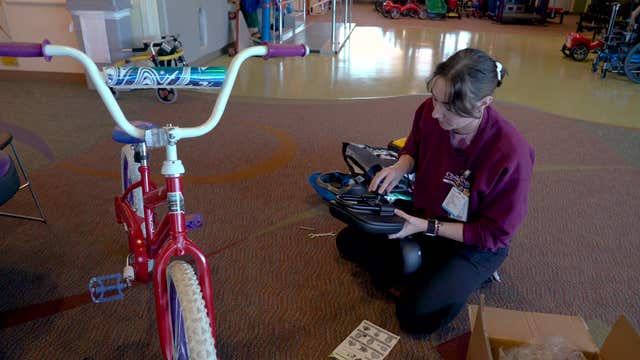 Watch: Nebraska boy with rare disorder rides customized bike for 1st time