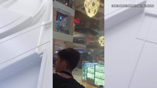 Car plummets from parking area into mall, killing 1