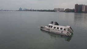 54-foot boat truck on its side in Detroit River