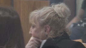 Woman convicted in spitting case settles suit