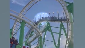 Man climbing out of moving roller coaster