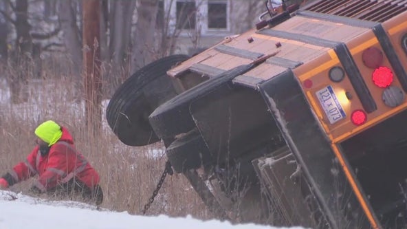 Michigan school bus slides off icy road into a ditch