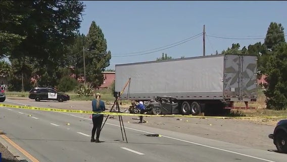 Car gets stuck underneath big rig in Fremont