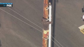 Man refuses to come down power pole