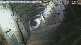 Man gets stuck in chimney while running from police