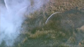 Fire crews battle large brush fire in Orland Hills