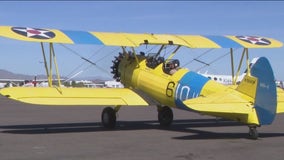 Veteran flies in WWII trainer plane with 'Grounded No More'