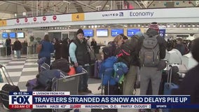 Travelers stranded as snow and delays pile up