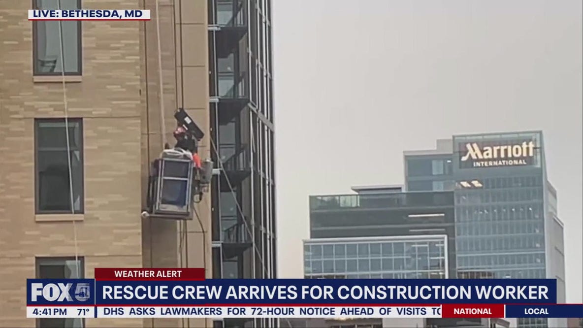 Construction worker rescued after being stuck on side of building