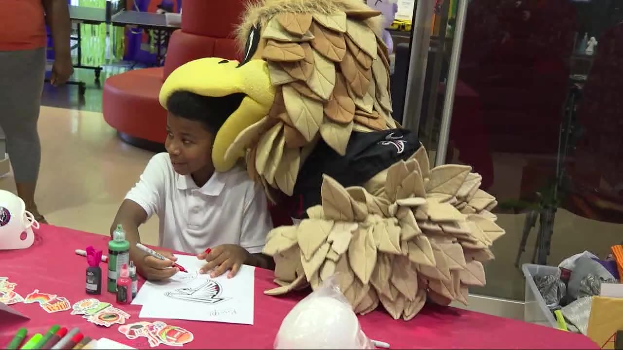 Falcons bring Halloween cheer to Scottish Rite kids