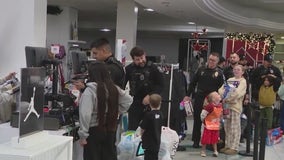 Kids holiday shop with Glendale Police officers