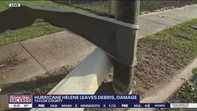 Roof wrapped around pole after Hurricane Helene pummels Florida