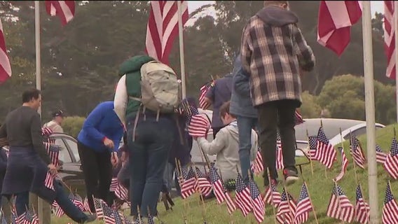 Scouts honor fallen heroes with flags at San Bruno national cemetery