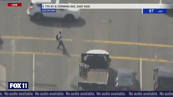Truck nearly hits pedestrian, crashes into other cars