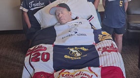 Longtime Michigan baseball coach receives quilt made of old uniforms