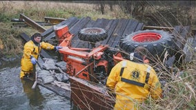 Man in serious condition after being trapped under tractor in Woodstock creek: officials