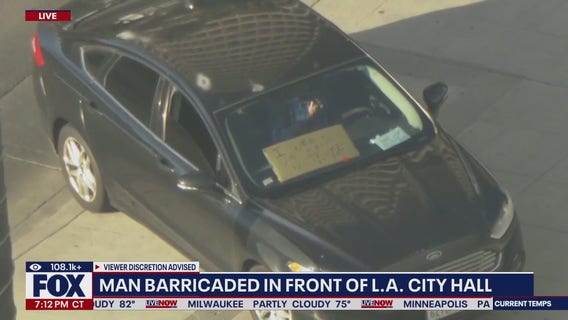 Man barricaded in car outside LA city hall