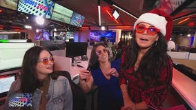 Angie, aka Santa Claus, delivers gifts to the FOX 5 newsroom