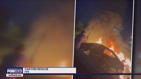 Video shows rescuers saving man trapped in burning Subaru