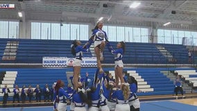 Maine East High School cheerleaders show out on Orange Friday