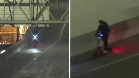 Person rides scooter on I-43 in Milwaukee