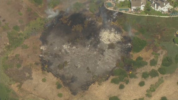 Crews stop fire from reaching nearby home