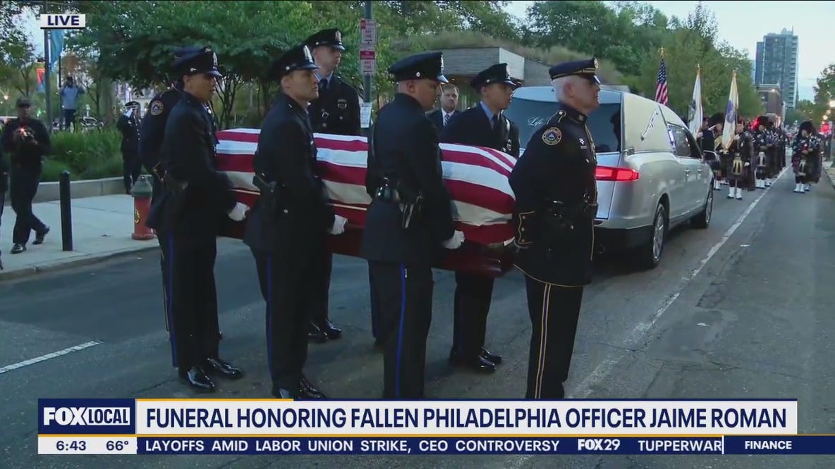 Casket of slain Philadelphia police officer Jaime Roman arrives at funeral service