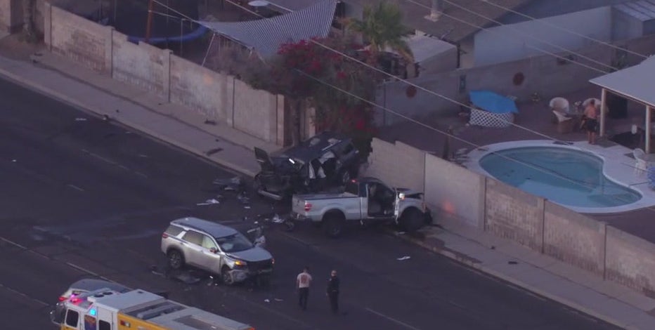 Multi-car crash leaves barrier wall destroyed, 4 people hospitalized