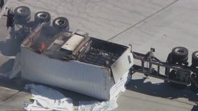 Big rig carrying lithium ion batteries flips over