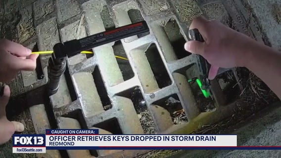 Redmond officer retrieves keys dropped in storm drain