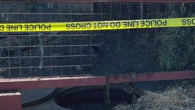 Crews work to recover body in underground vault