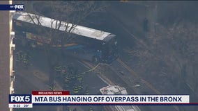 MTA bus hanging off overpass in the Bronx