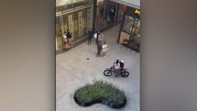 Dirt bike riders roll around Century City mall