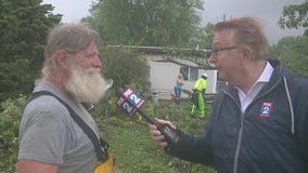 Rainy weather blocks roads, knocks down trees in metro Detroit