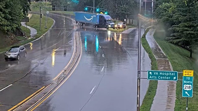 Video: Amazon semi-truck driver loses control, crashes on rainy city street