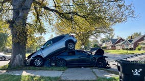 Crazy crash leaves one car on top of another on Detroit's East side