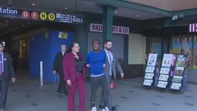 Man arrested after woman pushed onto subway tracks