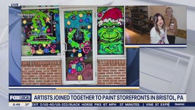 Artists work together to paint storefronts in Bristol