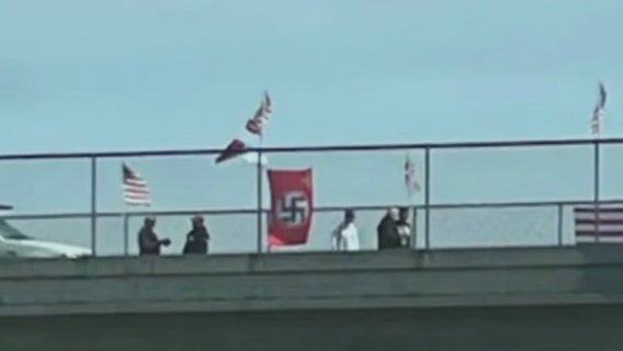 Protest over Hwy 101 swastika flag ends in unexpected understanding