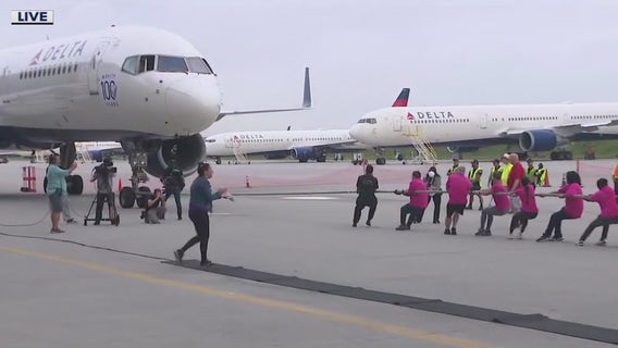 Delta employees attempt to pull planes for cancer research fundraiser