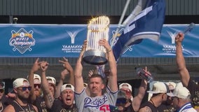 Walker Buehler celebrates with World Series trophy