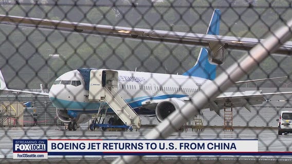 Boeing jet returns to U.S. from China