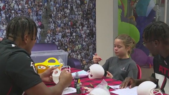 Falcons bring Halloween joy to kids at Children’s Healthcare