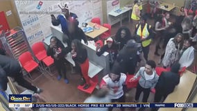 NJ officer hit in head with chair during wild brawl at Domino's pizza