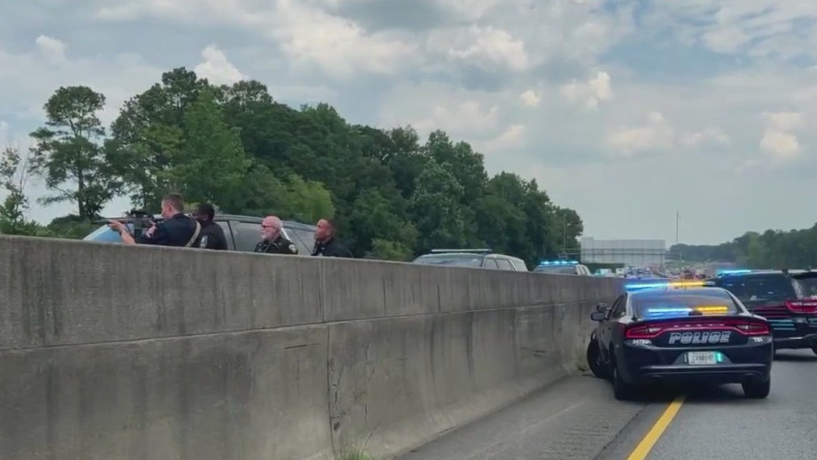 Suspected arrested after shooting at police, chase down highway
