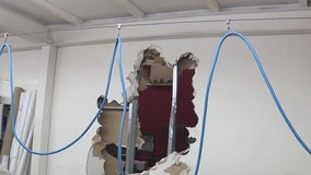 Burglars smash through walls to loot business