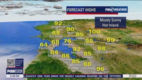 Mostly sunny, hot inland