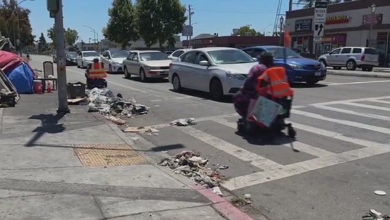 East Oakland disabled seniors riding wheelchairs in the street due to blight
