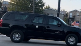 Kamala Harris arrives at DNC in Chicago, waves through car window