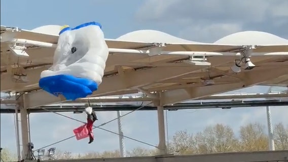 Parachutist left dangling from stadium roof as pregame stunt goes wrong